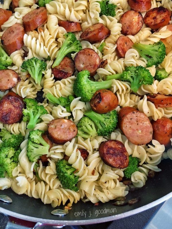 pasta with sausage and broccoli in a skillet