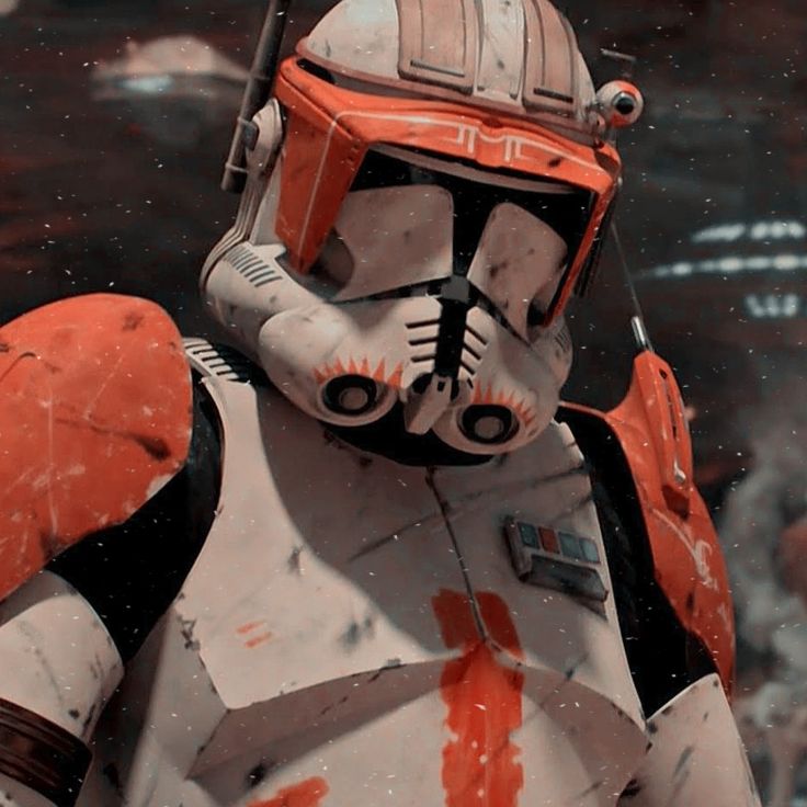 star wars the old republic character in armor and helmet with orange paint splattered on his face