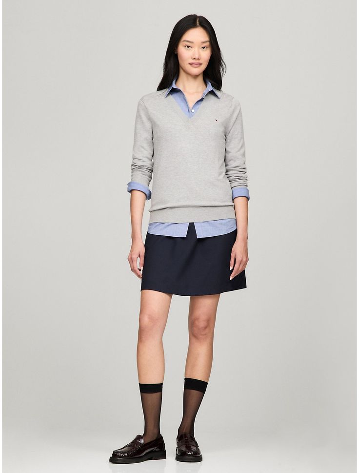 Tommy Hilfiger women's sweater. Made from a silky-smooth viscose blend, our versatile V-neck sweater is the wear-anywhere layer you'll be reaching for all season.  Material: 70% Sustainable Viscose (scv), 30% Polyamide. Classic V-neck Sweater For Spring Layering, Spring V-neck Sweater For Work, Casual Solid Color V-neck Sweater For Work, Casual V-neck Sweater For Business Casual, Spring V-neck Sweater For Workwear, Tommy Hilfiger Long Sleeve Sweater For Spring, Tommy Hilfiger V-neck Winter Top, Spring V-neck Sweater For Business Casual, Elegant Long Sleeve Tops By Tommy Hilfiger