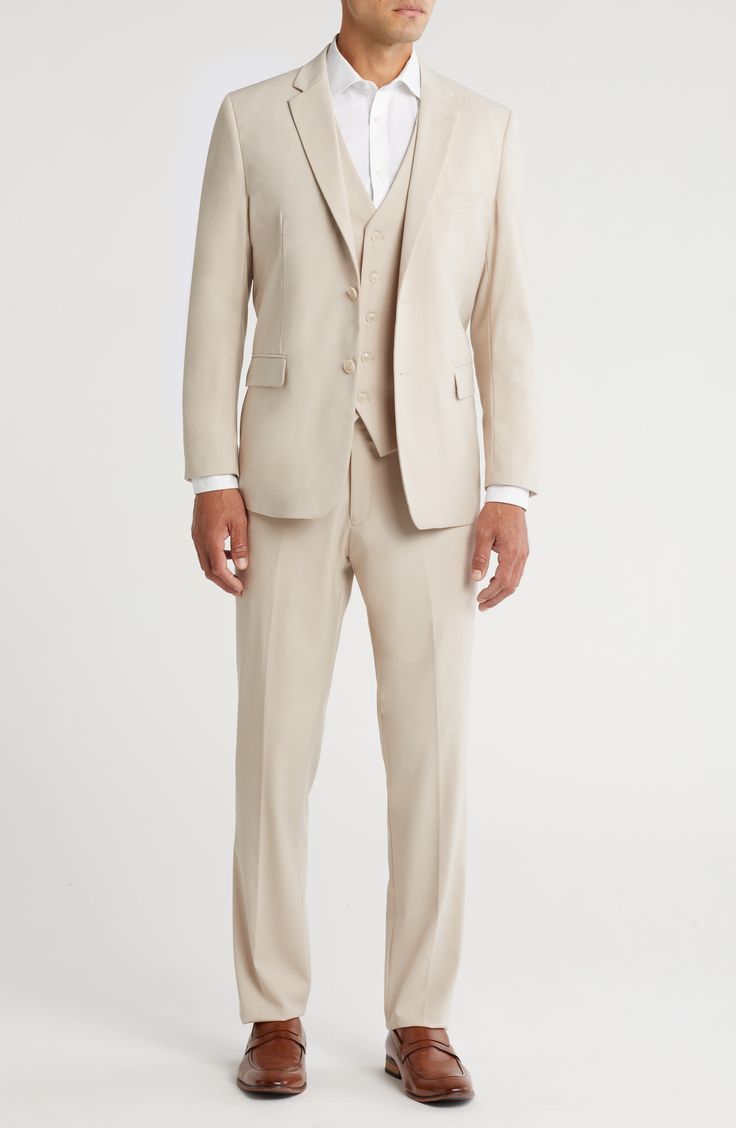 Bring understated elegance to the table in this three-piece suit crafted from rich fabric in a classic single-breasted silhouette. Jacket has notched lapels; chest welt pocket; front flap pockets Vest has front button closure; V-neck Pants have zip fly with button closure; front slant pockets; back button-welt pockets Jacket and vest are lined; trousers are lined to the knee 65% polyester, 35% viscose Dry clean Imported Suit has a 6” drop, meaning that a size 38R jacket is paired with size 32 pa Men Cream Suit, Creme Suits Men, Cream Color Suit, Creme Suit, Neutral Suits For Men, Off White Suit, Beige Suit Men Color Combinations, Tan Linen Suit Wedding, Suit Men Aesthetic