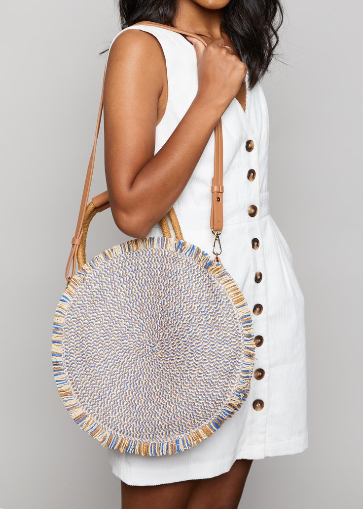 The Season in the Sun Bag is a woven, circular tote that is sure to add some flare to your favorite outfit! Blue like the sea & light as the summer breeze, this tote will keep you getaway-ready all season long! Trendy Braided Beach Bag For Spring, Chic Woven Beach Bag With Round Handle, Chic Spring Beach Bag With Round Handle, Trendy Straw Bag With Round Handle For Beach, Chic Braided Beach Bag For Spring, Spring Beach Bag In Natural Woven Leather, Woven Straw Beach Bag For Summer Outings, Summer Beach Bag With Bamboo Handle For Spring, Straw Woven Beach Bag For Summer Outings