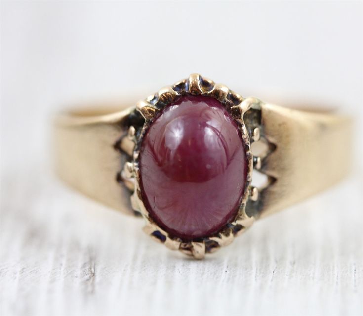 "L-651  AMAZING ANTIQUE SOLID 14K GOLD RING, SET WITH A NATURAL RUBY CABOCHON. EARLY BEZEL SETTING , SIMPLE SIDES. THE RUBY HAS ABRASIONS AND SCRATCHES. BEAUTIFUL DESIGN, WONDERFUL HIGHEST QUALITY. JUST PART OF MY MOST RECENT ESTATE FINDS! FOLLOW ME TO SEE THEM ALL!   Brand: Georgian Ruby Cabochon Metal: 14K Yellow Gold Metal Purity: 14K Material: Ruby Ring Size: 7.75 Other Dimensions: 1/2\" Form: Solitaire Ring Luxury Age: Antique Weight (Grams): 3.4g IT IS IN EXCELLENT ESTATE CONDITION  ALL IT Gold Ruby Ring Oval Cabochon With Polished Finish, Gold Domed Ruby Ring With Gemstone, Gold Ruby Ring With Domed Shape, Fine Jewelry Cabochon Ruby Ring In Yellow Gold, Heirloom Yellow Gold Ruby Signet Ring, Classic Yellow Gold Signet Ring With Cabochon, Heirloom Ruby Signet Ring In Yellow Gold, Fine Jewelry Ruby Ring In Yellow Gold With Cabochon, Cabochon Ruby Ring In Yellow Gold