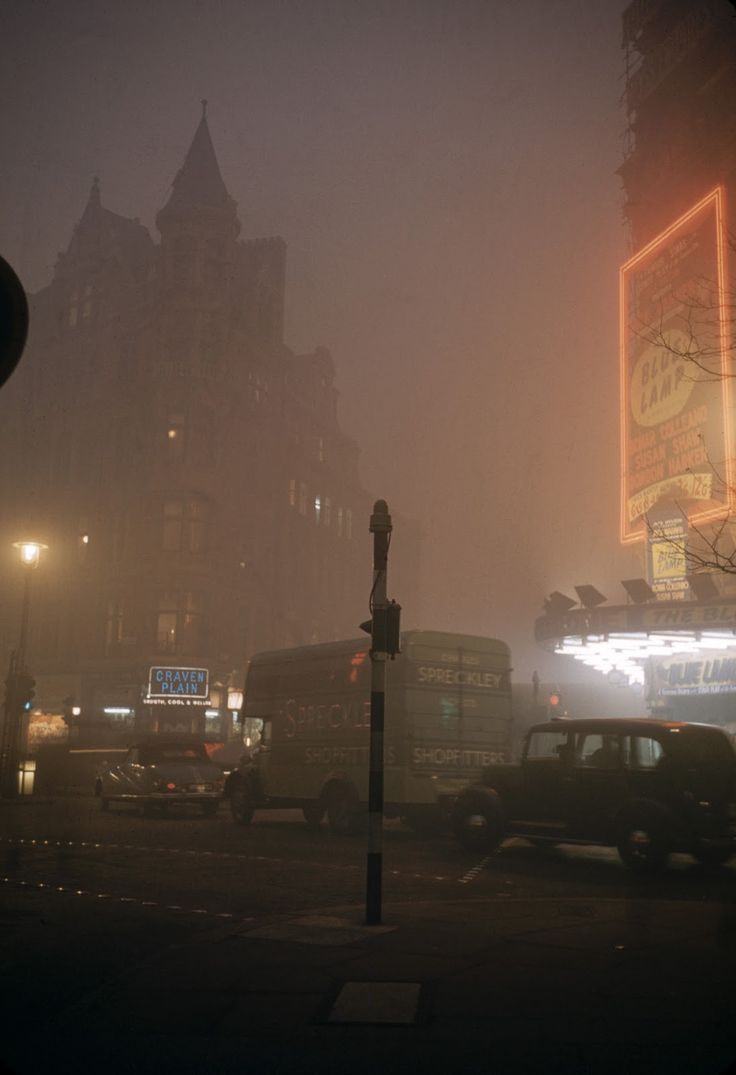 traffic on a foggy city street at night