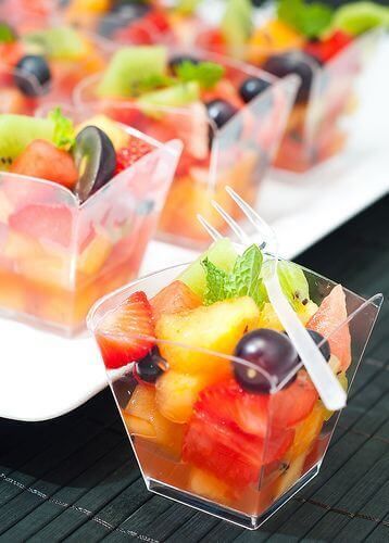 fruit salad in plastic containers on a table