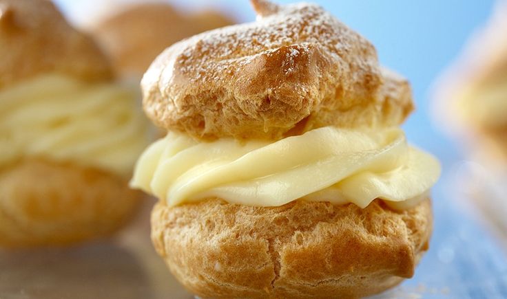 a close up of a pastry on a table with other pastries in the background