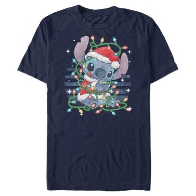 Ohana means family, and that means no tee gets left behind for Christmas with this officially licensed Disney Lilo & Stitch Playing with Lights Men's T-Shirt! This festive Men's design features an adorable Stitch trying to untangle himself from colorful Christmas lights while bright stars surround him. Your popularity will skyrocket once you wear this garment, so grab this new graphic tee for the holiday season and celebrate Christmas with style! Lilo And Stitch Shirt, Colorful Christmas Lights, Lilo And Stitch Merchandise, Santa Outfit, Ohana Means Family, Cute Stitch, Stitch Shirt, Colorful Christmas, Lilo Stitch