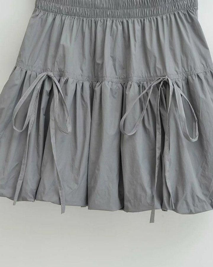 A chic skirt featuring a bubble hem design, elastic waistband, and adjustable drawstring details for a playful style. 100% PolyesterMade in Made In China Bubble Hem Skirt, Buckle Bunny, Chic Skirt, Playful Style, Chic Skirts, Bubble Hem, Hem Skirt, Gray Skirt, Made In China