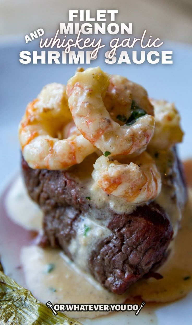 there is a steak and shrimp on the plate