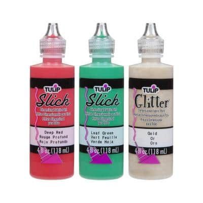 three different colors of glue sitting next to each other on a white background, one is green and the other is pink