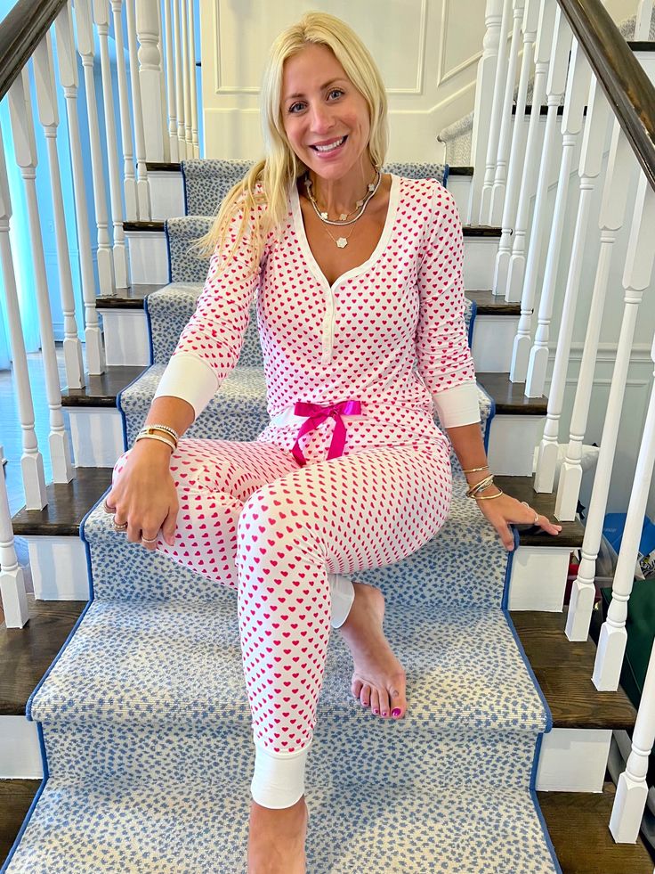 Our Pink Heart Pajamas are a classic and every Jordann Jammies lover MUST have this pair in their collection! This is one of the first pairs of pjs we ever made and always keep in our collection. They never go out of style!! These jammies are made in our signature, soft fabric! This set features our signature jogger pants & original long sleeve top. This set is the perfect pair of pjs to wear to feel cute and comfy! These pajamas fit true to size. I am wearing a medium. Size Recommendations: Sma Valentines Pajamas Women, Valentine Pajamas, Valentines Pajamas, Jam Jams, Heart Pajamas, Pajamas For Teens, Monogram Box, Monogram Hearts, Floral Joggers