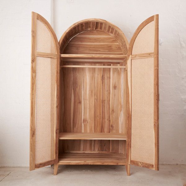 an open wooden cabinet sitting on top of a floor