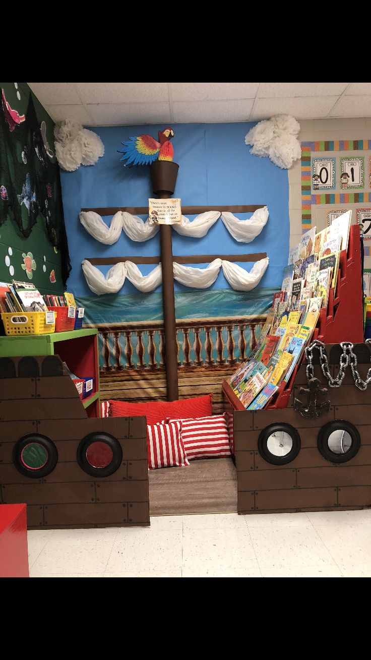 this is a pirate ship made out of cardboard and other items in the room that are on display