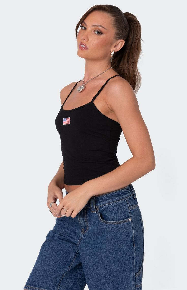 Online only! Feel like the ultimate American babe in this cute Edikted USA Tank Top. Pair this tank with any bottoms you like for the coolest effortless look. 


	Tank top
	Adjustable straps
	Embroidered patch
	Cotton, Spandex
	Model wears size S
	Model height is 5'8
	Item care: Machine wash at maximum 30C, do not bleach, tumble dry low, iron at a maximum of 110C, do not dry clean. Everyday Black Tank Top With Adjustable Straps, Casual Tank Strap Crop Top For Everyday, Casual Everyday Crop Top With Tank Straps, Casual Tank Straps Crop Top For Everyday, Casual Tops With Straps, Trendy Racerback Camisole For Summer, Trendy Summer Racerback Camisole, Black Casual Cami Tank Top, Casual Cotton Tank Top