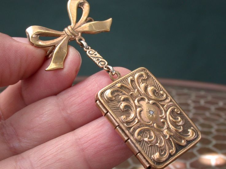 "WE SELL THIS NICE PHOTO LOCKET Pendant with pin brooch , MADE IN gold tone maybe filled decorated with little genuine diamond , in very good condition PLEASE SEE PICTURES , ORIGINAL PIECE IN IT'S ORIGINAL CONDITION AS PICTURED, the measures are 2 1/4\" x 1\" locket 1 1/8\" x 7/8\"/weight 10.4gr As is a vintage antique item , it's unique , for that if you like to wear it , don't miss the opportunity, we gladly offer MICRO-PAYMENTS upon request, email me with your payment plan. OUR POLICY: -YOU C Vintage Lockets, Antique Brooches, Photo Locket, Payment Plan, Chatelaine, Locket Necklace, Antique Items, Antique Victorian, Pin Brooch