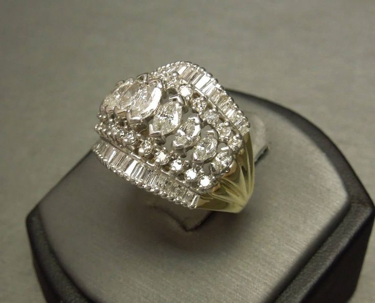 a diamond ring sitting on top of a display case