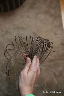 a person is holding some wire in their hand