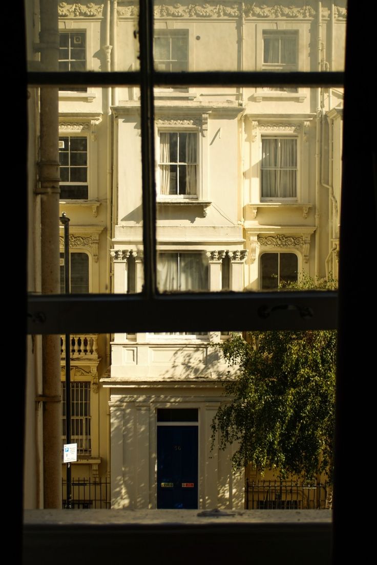 an open window looking out onto a building