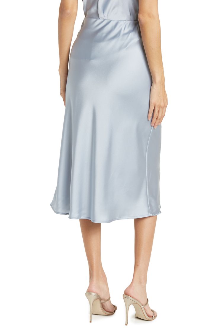 Elevate your wardrobe with this pull-on bias satin midi skirt for elegant, feminine style. 31" length (size S) Elasticized waist Pull-on style Satin construction 97% polyester, 3% spandex Machine wash cold, line dry Made in USA Model’s stats for sizing: 5’10” height, 34” bust, 27” waist, 35” hips. Model is wearing size S. Silk Bottoms With Satin Finish For Spring, Spring Silk Bottoms With Satin Finish, Sleek Spring Midi Skirt, Satin Bias Cut Bottoms For Spring, Bias Cut Satin Bottoms For Spring, Satin Midi Bottoms For Evening, Evening Satin Midi Bottoms, Sleek Spring Midi-length Bottoms, Sleek Satin Skirt For Spring