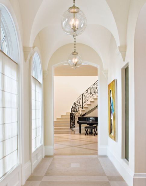 the hallway is clean and ready for guests to use it as an entrance way in this home