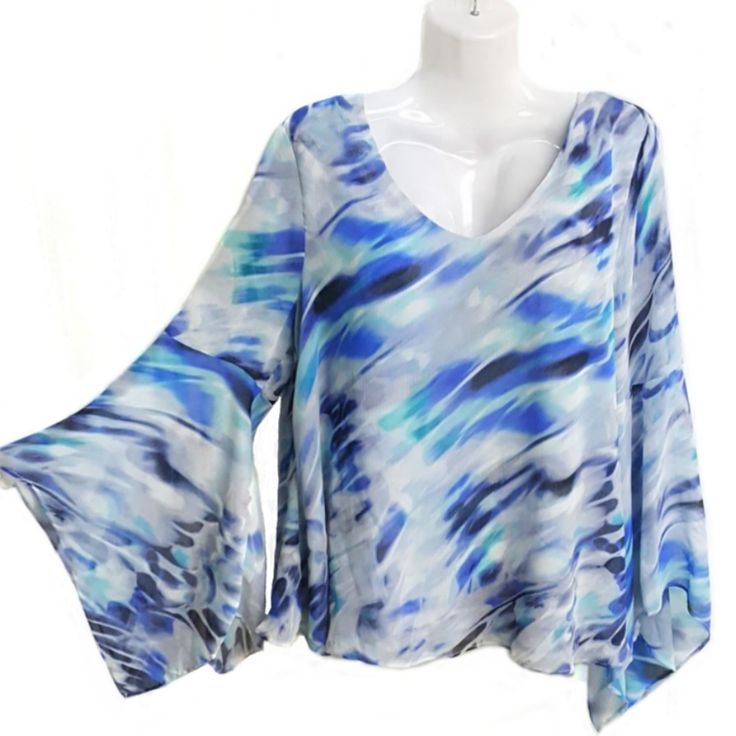 Flowy Layered Top In Blue Hues Sexy Bell Sleeve New With Tags Trendy Light Blue V-neck Blouse, Blue V-neck Top For Night Out, Blue Trendy Loose Fit Tops, Trendy Blue Flowy Top, Casual Blue Flowy Top, Blue Flowy V-neck Top, Blue Flowy Blouse For Party, Chic Flowy Blue Top, Trendy Blue Flowy Blouse