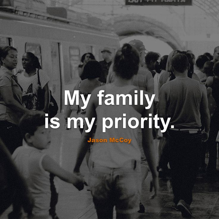 a group of people standing in front of a train at a station with the words, my family is my priority