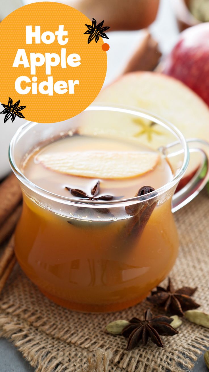 an apple cider with apples and cinnamon in the background