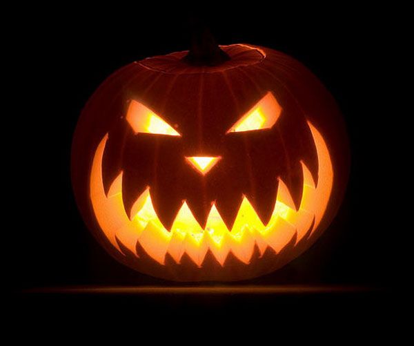 an illuminated jack o lantern in the dark