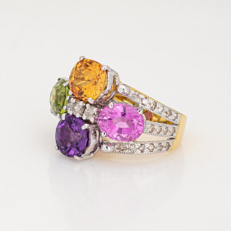 This is part of Chairish’s Fine Jewelry assortment.  Stylish multi semi-precious gemstone cocktail ring crafted in 14 karat yellow gold.   Citrine, amethyst, pink topaz & peridot each measure 8.5mm x 7mm. Diamonds total an estimated 0.40 carats (estimated at L-M color and SI2-I2 clarity). The stones are in very good condition and free of cracks or chips.    The multi-colored semi-precious gemstones add a beautiful pop of color on the hand. Sprinkled with diamonds, the ring is great worn during t Multicolor Sapphire Ring With Prong Setting For Formal Occasions, Luxury Multicolor Amethyst Ring For Anniversary, Multicolor Amethyst Rings With Accent Stones, Formal Multicolor Sapphire Ring With Prong Setting, Formal Multicolor Diamond Ring With Accent Stones, Luxury Multicolor Amethyst Ring For Formal Occasions, Multicolor Oval Amethyst Ring With Gemstone Accents, Formal Multicolor Rings With Prong Setting, Multicolor Oval Amethyst Ring With Accent Stones