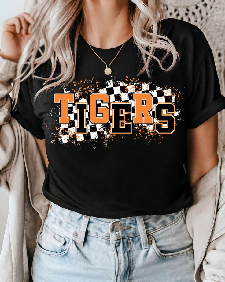 Looking for a way to show off your love for the Tigers? Made with high-quality direct-to-film transfer, this full-color transfer is perfect for showing off your school spirit at games, tailgates, or just around town. With its bold and vibrant design, this transfer will stand out on any color t-shirt you choose to apply it on. And because it can be applied to cotton, poly-cotton blends, un-coated polyesters, and 50/50 blends, you'll have plenty of options to choose from. This Tigers DTF Transfer Tiger Tshirt Ideas, Spirit Wear Designs, Cheer Apparel, School Spirit Shirts Designs, Tigers Shirt, Mascot Shirt, School Spirit Shirts, Tiger Shirt, Football Mom Shirts