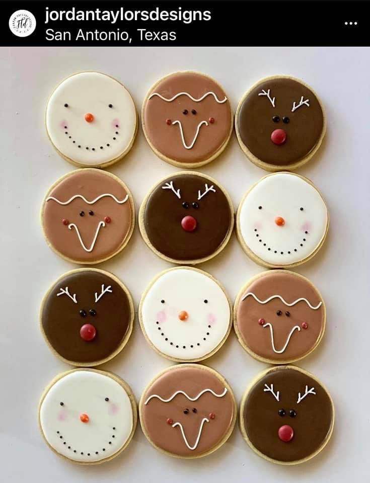 twelve decorated cookies arranged in the shape of reindeer faces