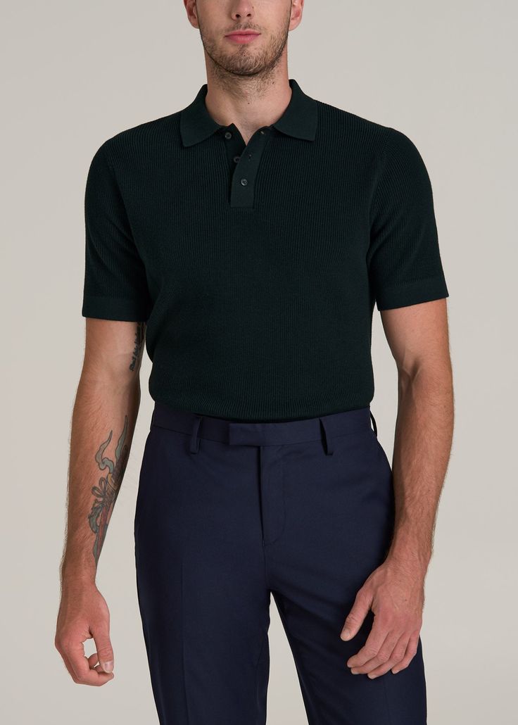 Purl Knit Polo for the Tall Man with Style Refined Relaxation Elevate your casual look with our Purl Knit Tall Men's Polo Shirt. This isn't just an extra-long polo shirt—it's a statement of sophistication made with the taller guy in mind. The modern fit and longer-than-hip length ensure a sleek silhouette without sacrificing comfort. Whether it’s for a smart-casual meeting or a weekend getaway, this men's tall polo shirt, with its ribbed hem and cuffs, ensures you stand out in the best way possi Casual Wool Tops With Short Sleeves, Casual Short Sleeve Wool Tops, Green Wool Casual Tops, Casual Green Wool Tops, Casual Knitted Merino Wool Polo Sweater, Mens Knit Polo Shirt Outfit, Classic Fitted Knit Polo Shirt, Classic Ribbed Knit Polo Shirt, Classic Collared Polo Shirt With 4-way Stretch