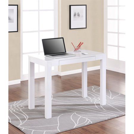 a white desk with a laptop on it