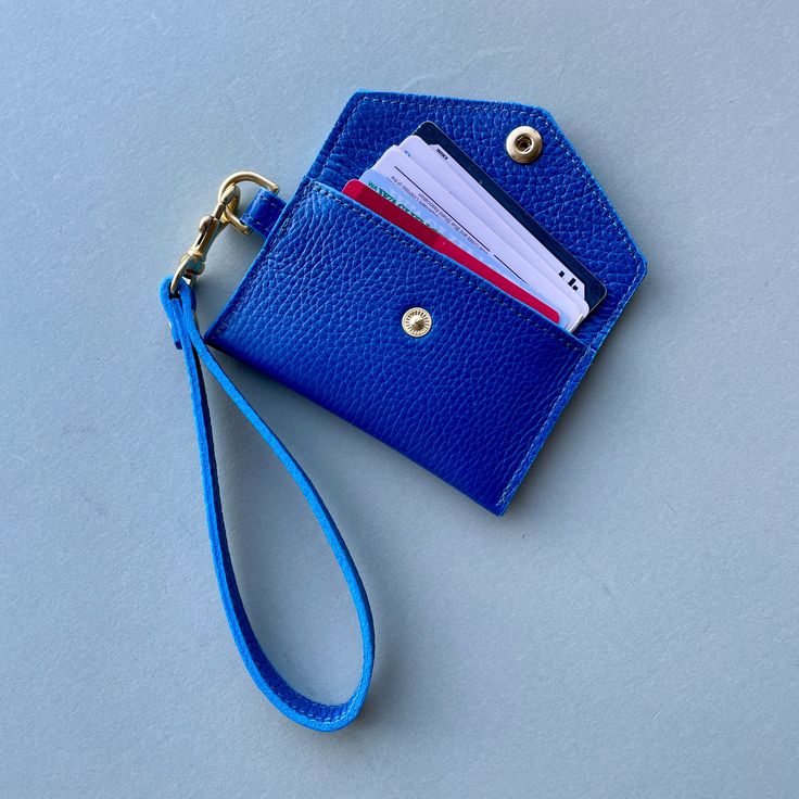 Crafted with premium Italian Pebble Grain Leather, this minimalist envelope wristlet is the perfect accessory for beautiful simplicity. Toss it in a bag or just wear out alone with as a no fuss, classically designed accessory. SHIPS IN 7-10 BUSINESS DAYS SPECS Dimensions: 3”H x 4.5”W Wristlet Strap: 6" opening, 8" including hardware Solid Brass D-Ring, Bolt Snap and Snap closure Lined with Leather Hand Painted edges FABRIC CARE Spot clean. ADDITIONAL FEATURES Holds up to 8 cards Detachable strap Elegant Rectangular Coin Purse With Wrist Strap, Classic Clutch With Wrist Strap For Everyday Use, Everyday Coin Purse With Wrist Strap, Everyday Coin Purse Clutch With Wrist Strap, Versatile Wristlet With Adjustable Strap For Daily Use, Classic Everyday Clutch With Wrist Strap, Elegant Everyday Coin Purse With Cell Phone Pocket, Everyday Wristlet Clutch With Adjustable Strap, Everyday Clutch Wristlet With Adjustable Strap