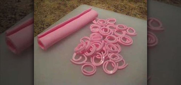 there are many pink rings on top of the cutting board, and one is empty