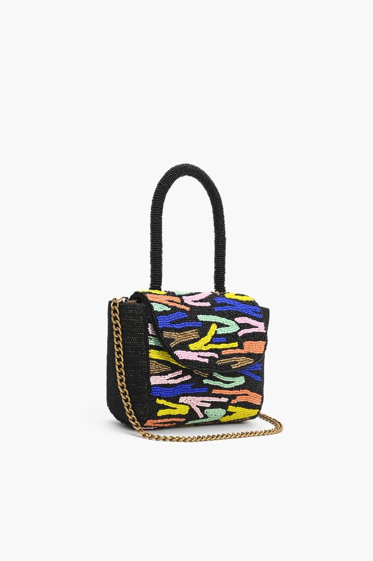 Introducing our Hand-Embroidered Rainbow Night Party Tote Bag—a vibrant and celebratory accessory that brings the joy of a colorful night to your ensemble. This tote is not just a bag; it's a festive expression of style, handcrafted with meticulous detail to make a bold statement. The Embroidery shimmers with metallic threads, reflecting the spirit of a lively and dazzling night party Crafted in Lurex jacquard Multicolor, Beaded Round Top Handle Stunning Hand embellished beading and threadwork Fold over top with magnetic fastening Handcrafted by artisans Bag Dimensions: 6.5" x 5" x 2" Handmade by artisans in India Party Bags With Multicolor Embroidery And Beaded Details, Multicolor Embroidered Party Bag, Embroidered Multicolor Evening Bag, Festival Multicolor Embroidered Beaded Bags, Multicolor Embroidered Beaded Rectangular Shoulder Bag, Embroidered Rainbow, Artisan Bag, Personalized Letters, Night Party