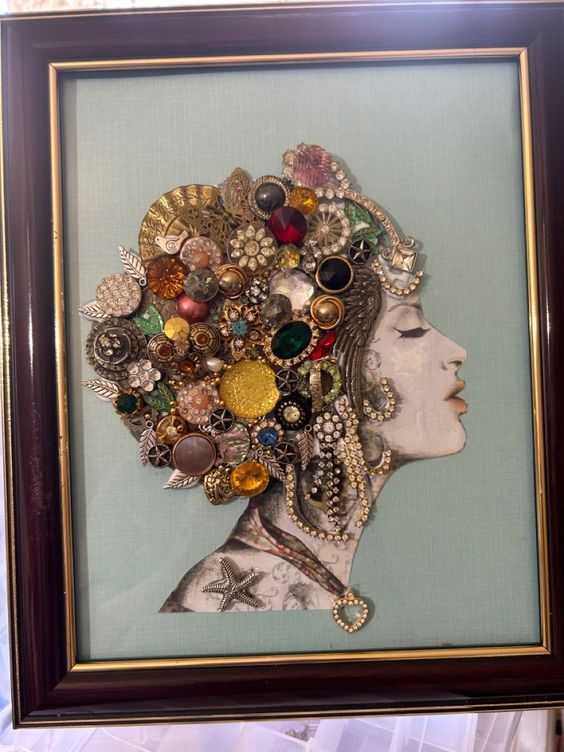 a woman's head is framed in a frame with buttons and brooches on it