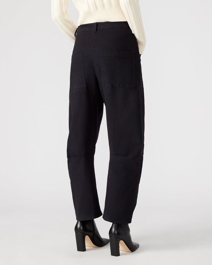 Introducing the HANIEL pant - a professional and stylish barrel leg pant with utility pockets made from stretch cotton twill. Enjoy the comfort and versatility of these pants while looking polished and organized. Perfect for work or casual wear. Barrel leg pant Two functional front pockets Inseam: 27" 98% cotton 2% elastane Hand wash Amelia is 5ft 10.5in and is wearing a size small Fit tip: If you are in between sizes, size down Imported Cropped Leg Cotton Work Pants With Pockets, Wide Leg Cotton Cargo Jeans For Workwear, Utility Cotton Pants With Cropped Leg, Wide-leg Work Pants With Patch Pockets, Utility Wide Leg Bottoms For Workwear, Cropped Wide Leg Cotton Pants With Side Pockets, Utility High-waisted Jeans With Welt Pockets, Cotton Cargo Jeans With Patch Pockets For Workwear, Cotton Cargo Jeans With Belt Loops For Work