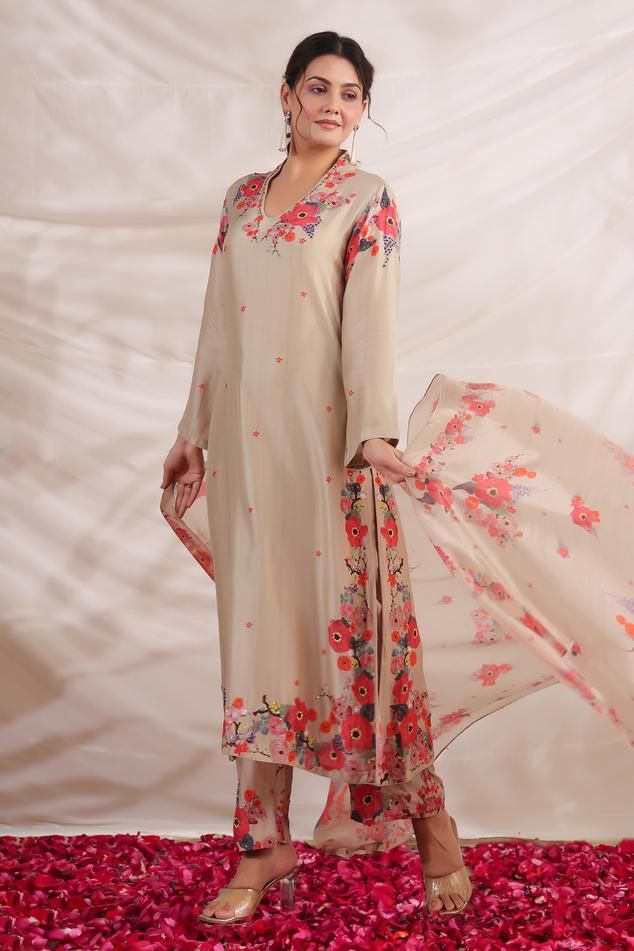 Ivory silk kurta with multi color placement floral print, sequin, bead and French knot thread embroidered highlights. Paired with printed palazzo and dupatta.
Components: 3
Pattern: Printed and Hand Embroidered
Type Of Work: Floral Print, Bead, Sequin and French Knot Thread Work
Neckline: V Neck
Sleeve Type: Full Sleeves
Fabric: Silk, Dupatta: Mulberry Silk
Color: Ivory
Other Details: 
Bead tasselled dupatta edges
Side slits
Embroidered highlights
Model height: 5ft inches, wearing size S
Occasio Bohemian Straight Kurta Set With Floral Embroidery, Semi-stitched Silk Kurta With Floral Embroidery, Cream Floral Embroidered Straight Kurta, Knot Thread, Bohemian Dupatta With Floral Embroidery, Semi-stitched, Bohemian Floral Print Semi-stitched Kurta, Kurta With Palazzo, Kurta Palazzo Set, Palazzo Set