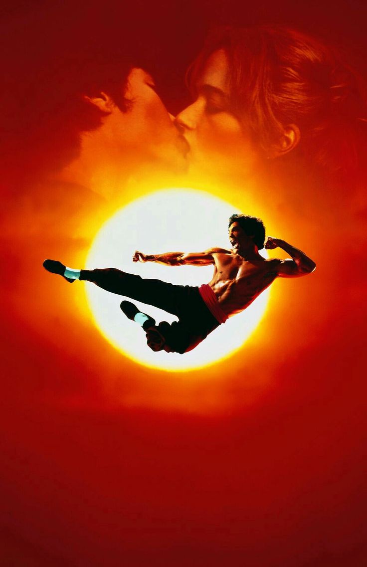 a man flying through the air while riding a skateboard in front of a sun