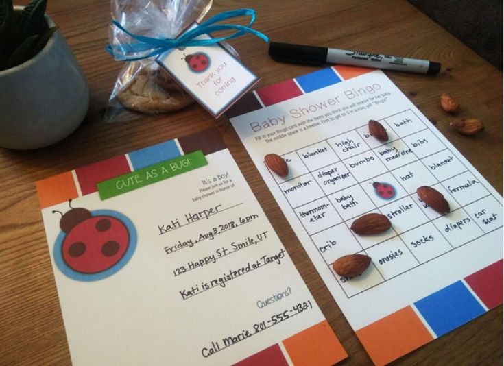 two cards with ladybugs on them sitting next to a potted plant and pencils