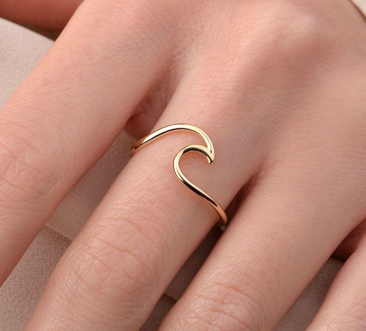 Our wave ring is 14k solid gold and it is kind and minimalist enough to accompany you at any time of the day. If you consider it as a gift for special days like birthdays, anniversaries, graduations, mother's day, or valentine's day, it makes happy your loved ones. If you want, you can add a gift note for your loved ones. It arrives in a special jewelry gift box. We respond to your questions happily. Your question will be answered within 24 hours. Do not hesitate to contact us. I hope you have a Minimalist Rings Gold, Waves Ring, Minimalistic Rings, Minimalist Accessories Jewellery, Sapphire Jewelry Set, Gold Wave Ring, Ocean Ring, Wave Jewelry, Gold Bracelet Simple