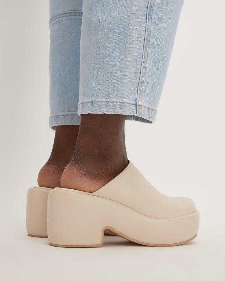 The Puffa Clog Parchment – Everlane Modern Chunky Platform Clogs For Spring, Modern Chunky Platform Slip-on Mules, Trendy Leather Platform Slippers With Block Heel, Trendy Mules With Chunky Wedge Platform, Modern Chunky Platform Wedge Heel Mules, Spring Chunky Platform Slip-on Mules, Spring Chunky Platform Block Heel Clogs, Synthetic Platform Slip-on Slippers With Padded Heel, Synthetic Platform Slippers With Padded Heel