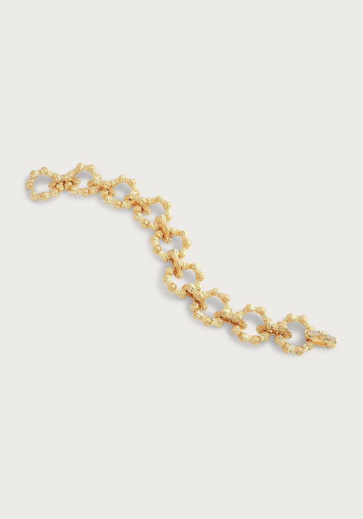 This modern heirloom, sculpted in 18k gold dipped brass with a shimmering crystal studded hidden closure is timeless and easy to wear. The jewelry piece of the century! Made from the finest 18k gold dipped brass, with a dash of shimmering crystals and a hidden closure that's the cherry on top. Wear it effortlessly forever, no fussing required. 18K Gold Plated Brass Crystal 7.7" L x 0.8" W Bamboo Jewelry, Cherry On Top, Gold Dipped, Hinged Bangle, The Grace, Sparkling Crystal, Chain Bracelet, Jewelry Pieces, Timeless Elegance