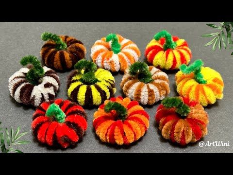 small knitted pumpkins sitting on top of a table