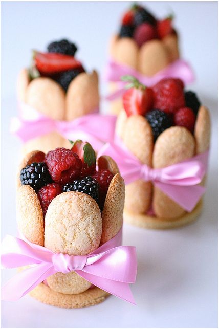 some cookies with berries and raspberries in them