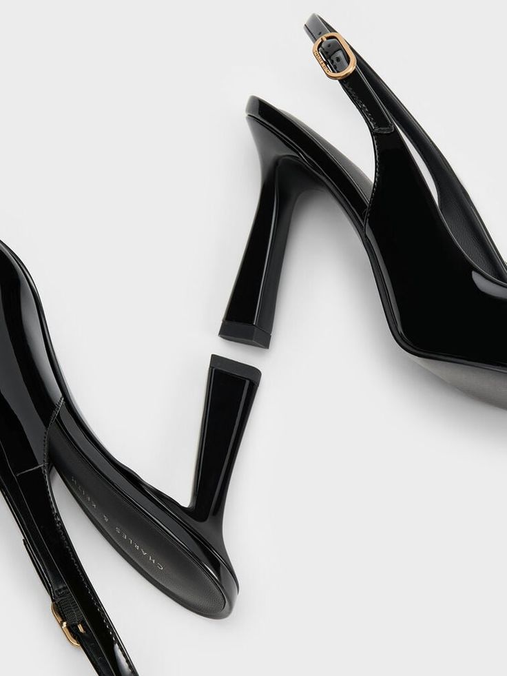 Step into any room with confidence in these patent slingback pumps. The sleek pointed-toed silhouette and high-shine black finish effortlessly exudes sophistication and poise. Perched on elegant 9cm trapeze heels, these shoes will elongate your frame for a flattering leg-lengthening effect - perfect when paired with sharp pantsuits. With adjustable slingback straps for a custom fit, these shoes are your best bet for an instant confidence booster. Confidence Boosters, Charles Keith, Slingback Pump, Black Pumps, Custom Fit, Sleek, Pumps, Confidence, Heels