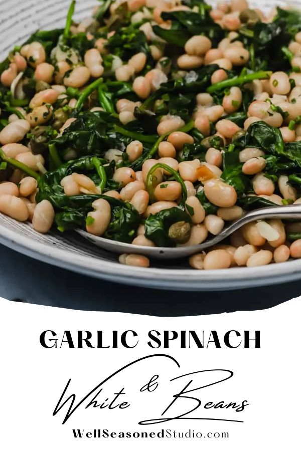 garlic spinach and white bean salad on a plate