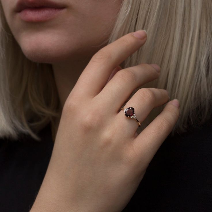 A strikingly beautiful Red Garnet ring surrounded by Six Diamonds. Flaunting a beautiful natural gemstone in a classic and elegant design to wear everyday. Handmade by artist in solid gold with an utmost attention to details. Beautifully finished with Each diamond and gemstone handpicked and inspected for the best color and depth. Get this ring today and enjoy it forever! Ring Features * Made to Order, perfectly finished, Fast shipping fully insured and traceable online. * Made in Solid 10K, 14K Garnet Cluster Promise Ring In Fine Jewelry Style, Garnet Cluster Ring For Promise, Fine Jewelry, Elegant Garnet Cluster Ring With Birthstone, Elegant Garnet Birthstone Cluster Ring, Garnet Birthstone Cluster Ring, Fine Jewelry Yellow Gold Garnet Ring, Yellow Gold Garnet Ring Fine Jewelry, Garnet Gemstone Cluster Ring Gift, Fine Jewelry Round Cluster Ring With Garnet