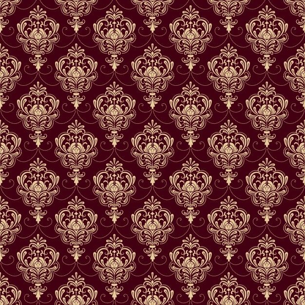 a red and gold wallpaper with an ornate design