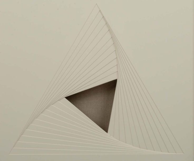 an abstract drawing with lines in the shape of a triangle on a white wall and floor